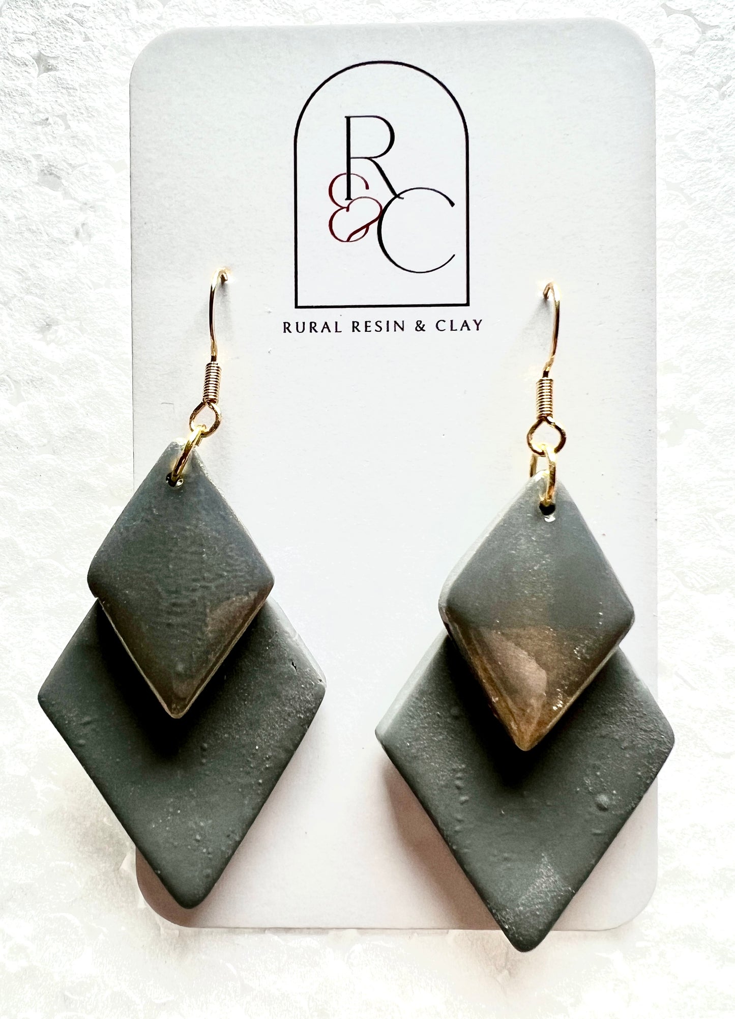 Grey diamond with a gold shimmer diamond