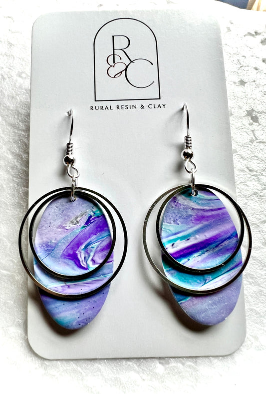 Purples, turquoise’s, white and shimmer in these ovals