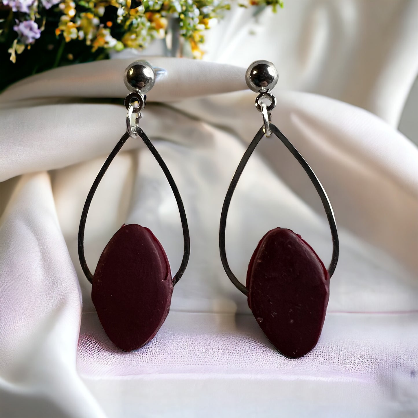 The Jillian is a simple tear drop with clay gem.