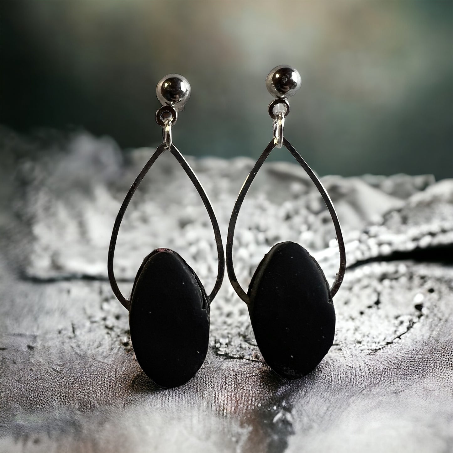 The Jillian is a simple tear drop with clay gem.