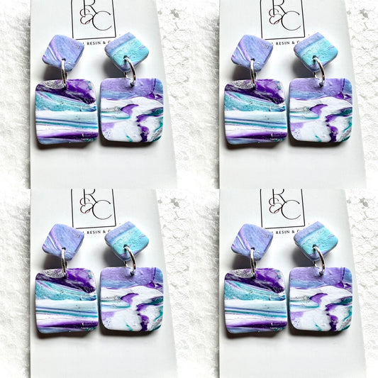 Ripples of purples, aquas with white