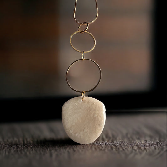 Ivory and white pendant with gold